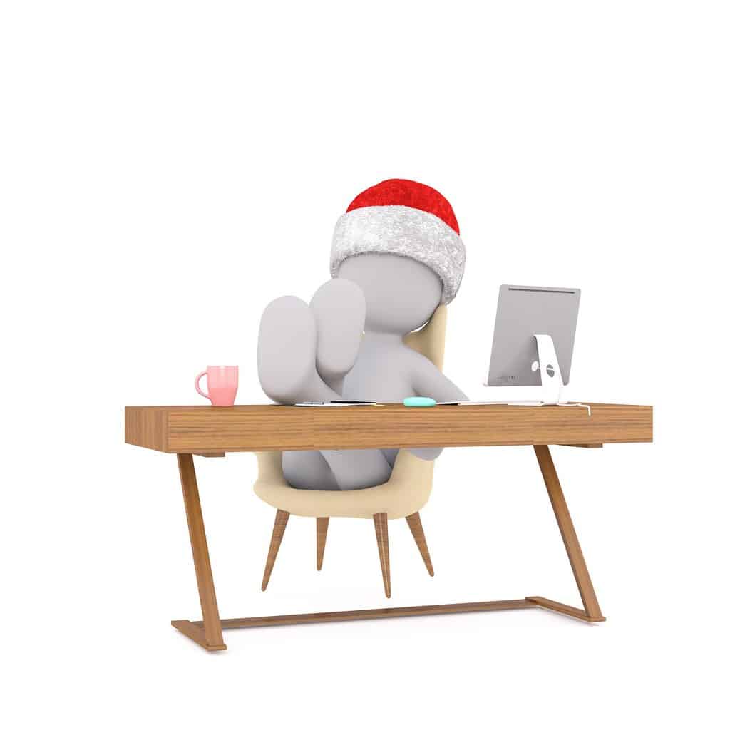 employee with feet up on the desk - employee refusing to work overtime at Christmas