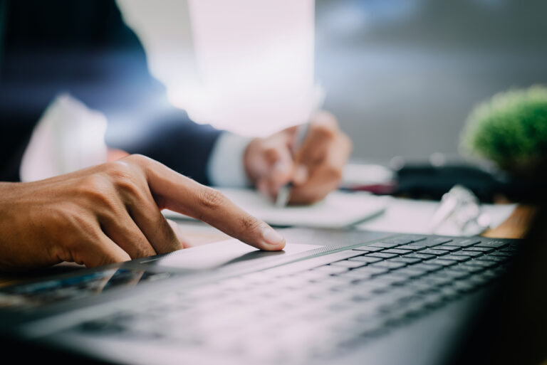 Pictures,Of,Businessman,That,Operate,On,The,Table,Being,Checking A candidate using Google for Jobs to search for a role
