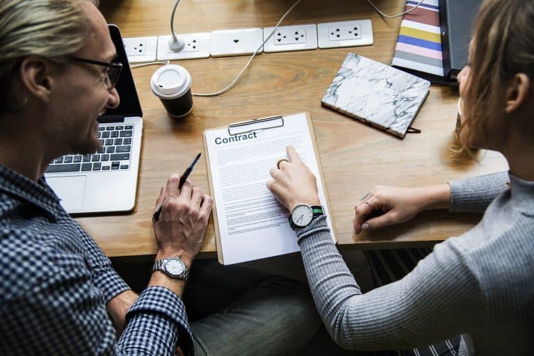 Two professionals considering how HR can impact your business