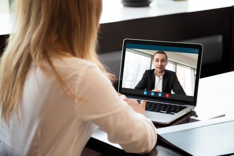 How to manage remote teams - two individuals video call each other for a business call