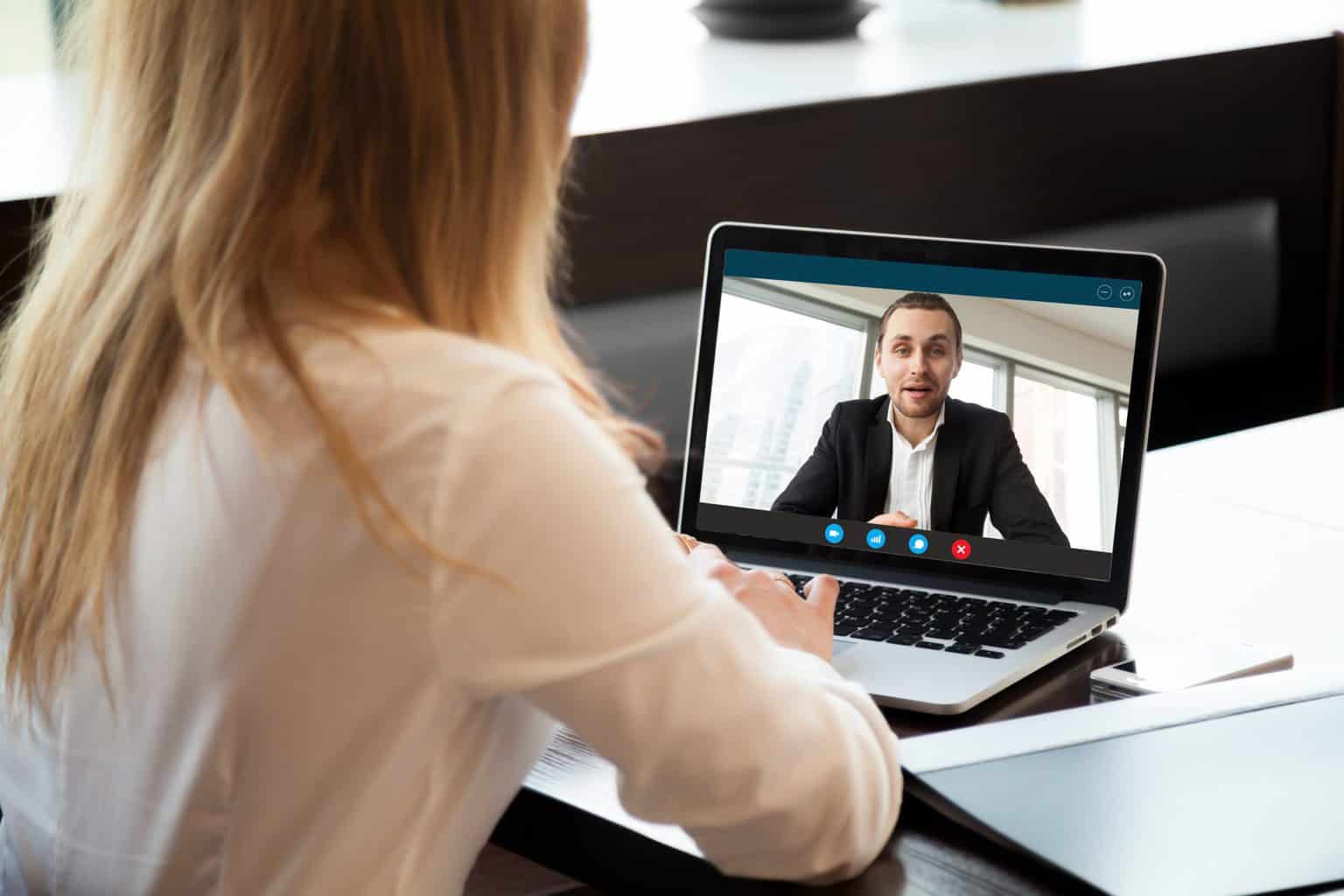 How to manage remote teams - two individuals video call each other for a business call