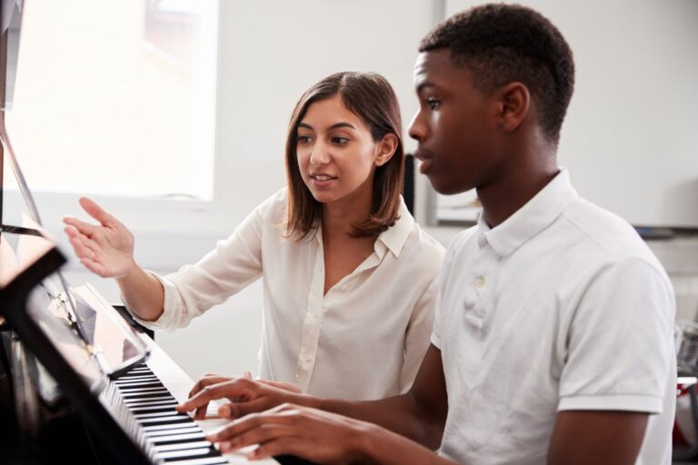 Harpur Trust v Brazel - calculating holiday pay for part time workers - music teacher instructs pupil in front of a piano