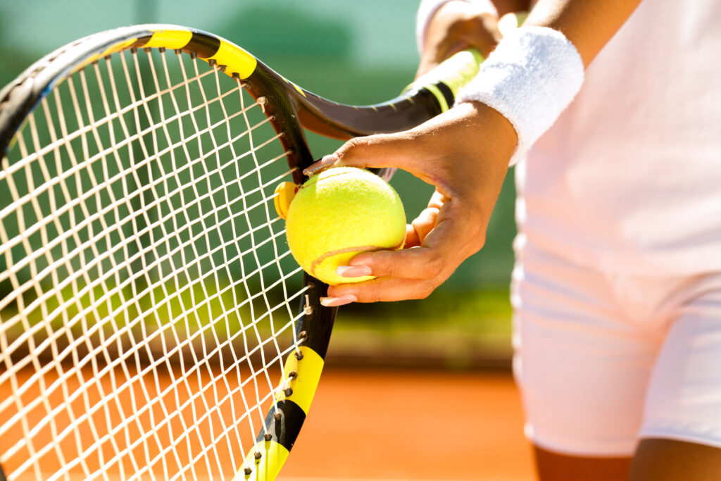 An image shows a tennis player. How to manage staff during major sporting events such as Wimbledon.