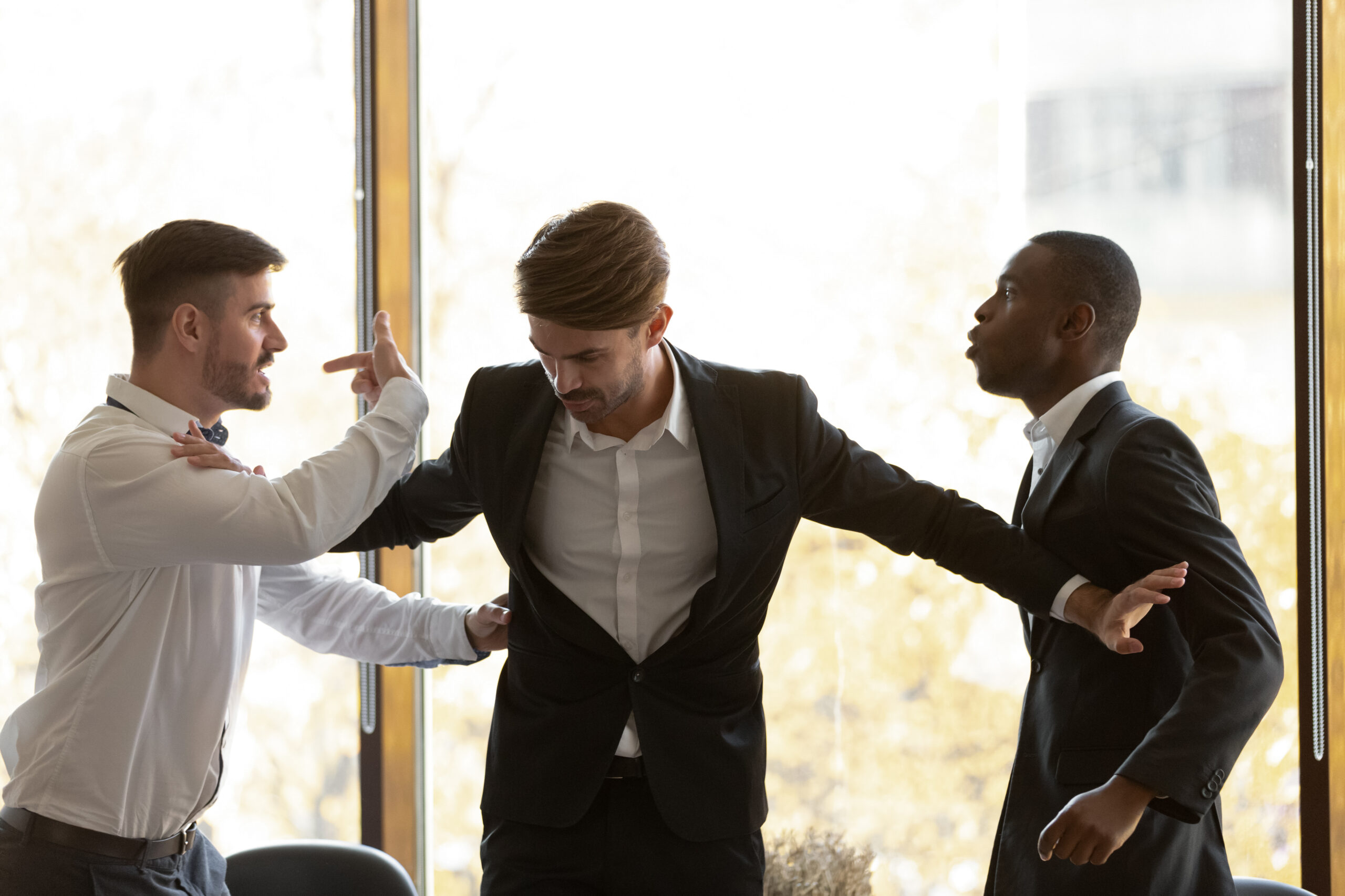 Two males fighting in work. An example of gross misconduct in the workplace.