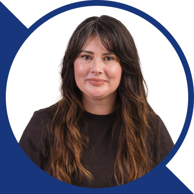 Lea-Marsden-Harvey-Headshot- Blue Arrow Down Left Shape